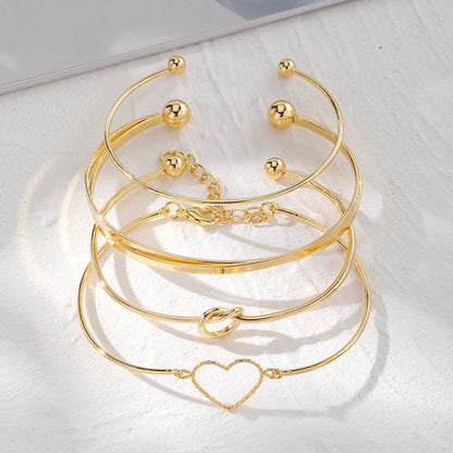 4-Piece Creative Heart Crossed Alloy Bangle Bracelet Set